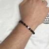 By Gabay, Armbånd med sølvkors, glas- og træperler